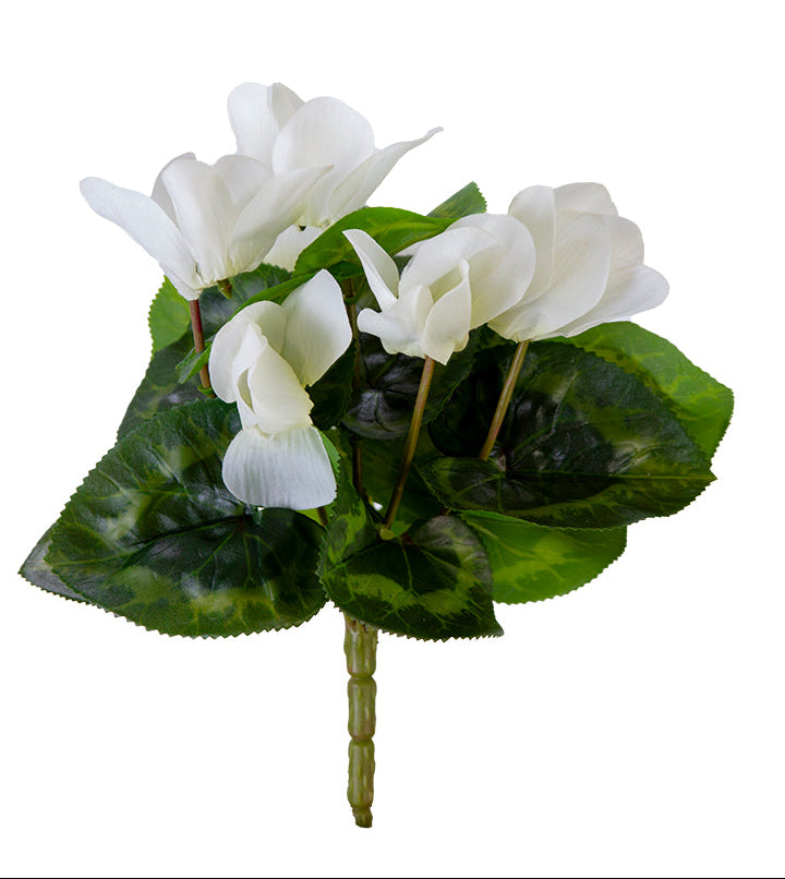 Artificial flower arrangement with white flowers and green leaves on a white background
