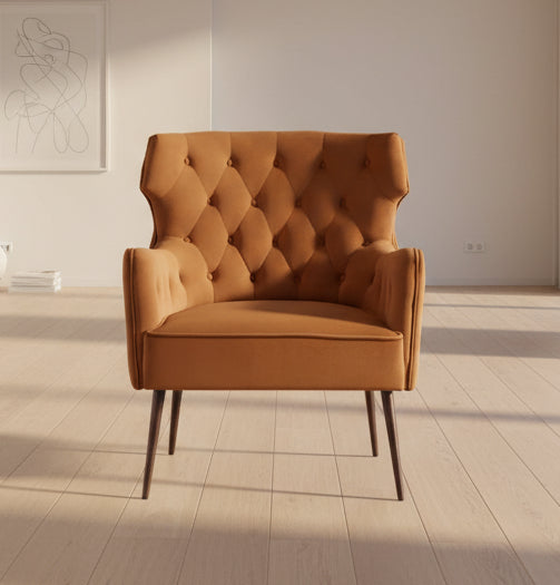 Rust armchair with tufted backrest on a white background