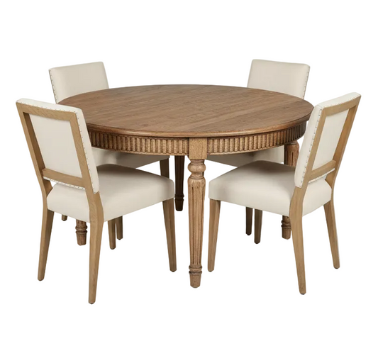 Round wooden dining table with four matching chairs on a white background