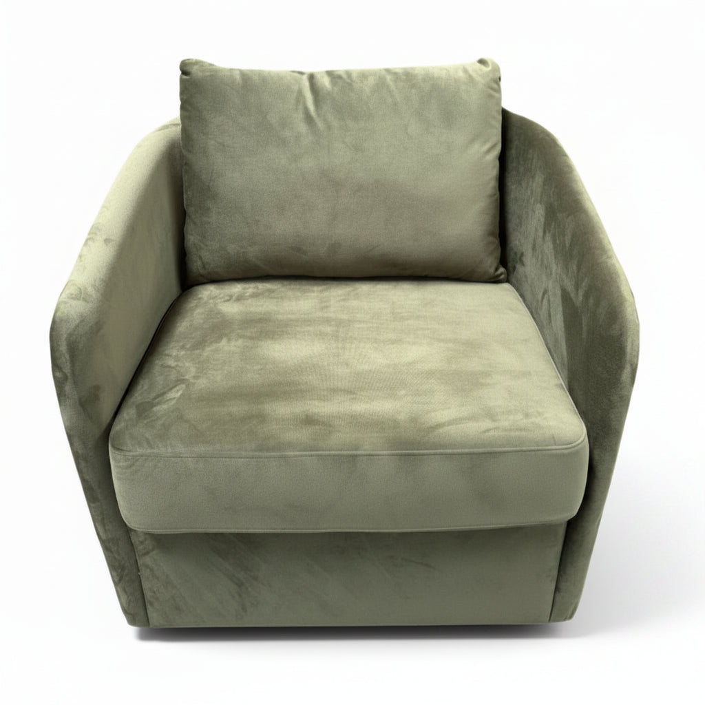 Green armchair with a pillow on a white background