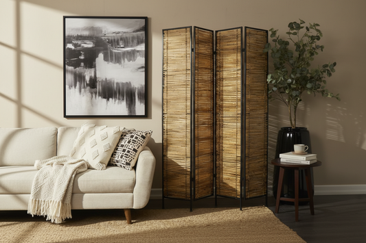 A room divider with a polished black frame and textured bamboo panels in varying shades of light and dark brown.