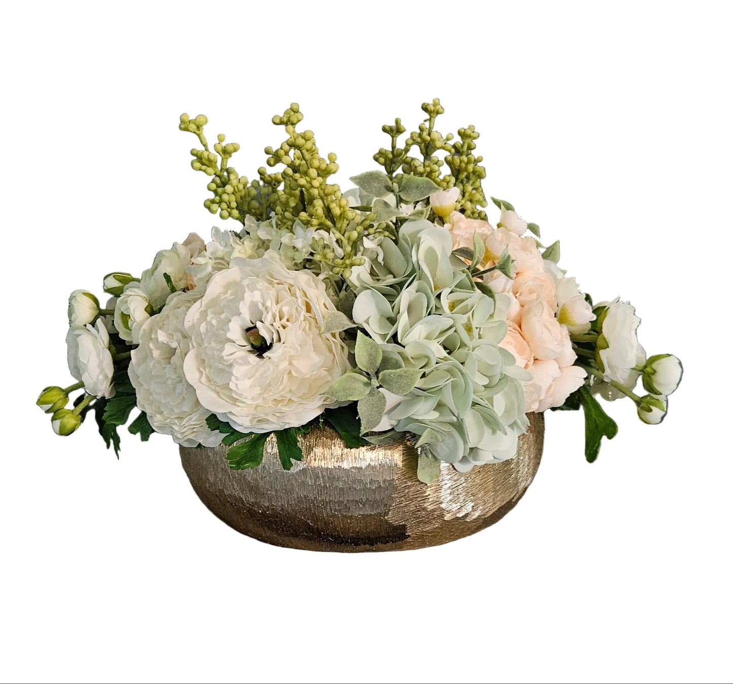 Floral arrangement in a metallic bowl on a white background