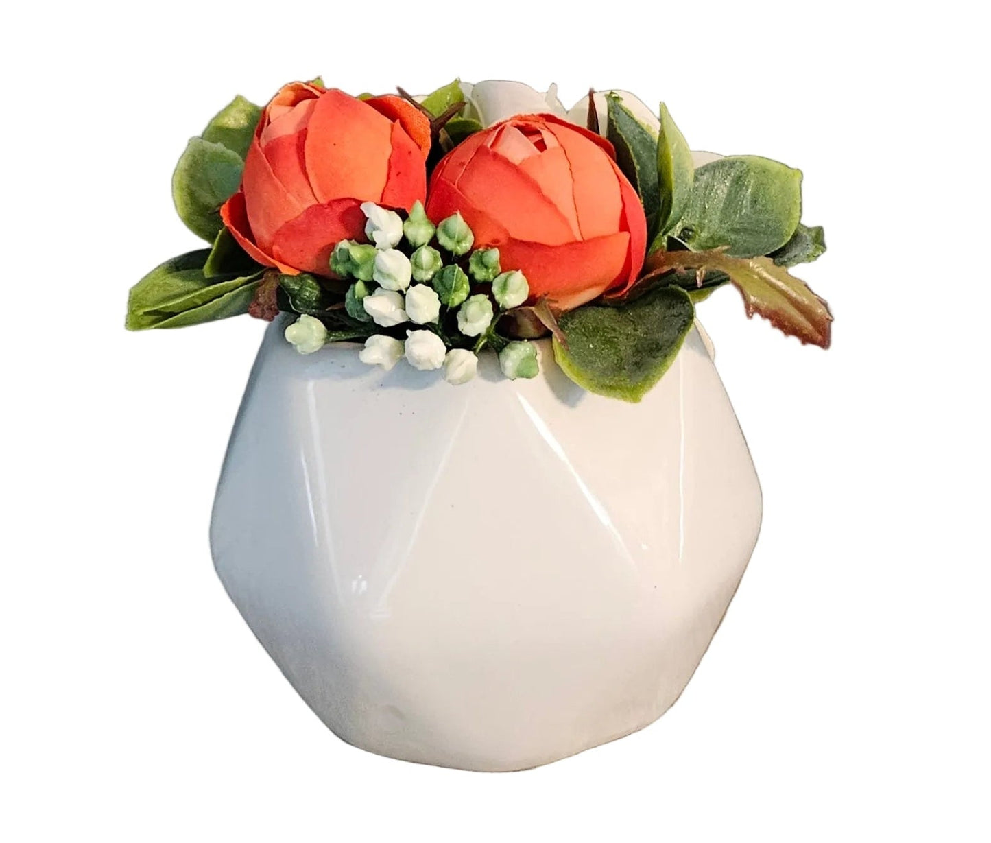 White vase with orange flowers and green leaves on a white background