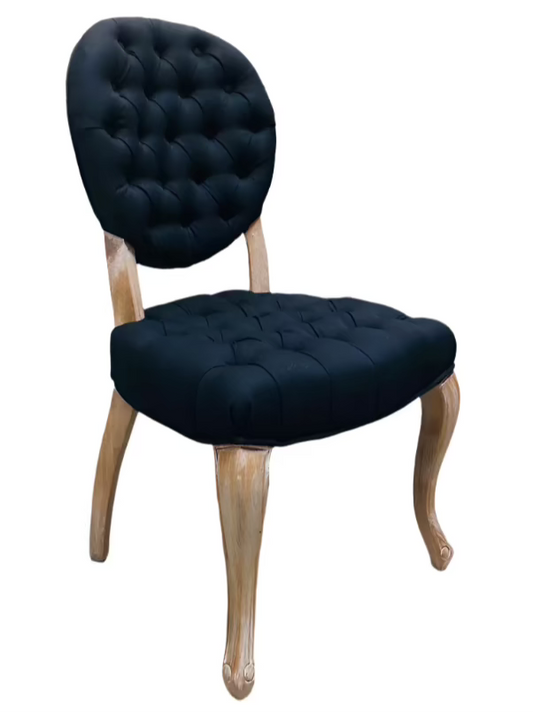 Chair with dark blue tufted seat and backrest on a white background