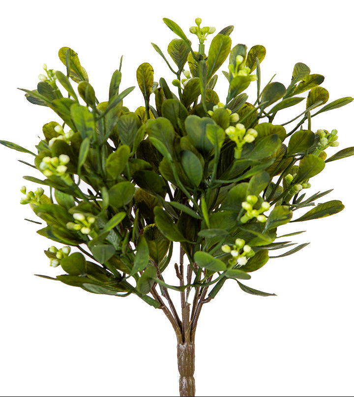 Artificial green bush with leaves on a white background