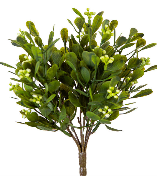 Artificial green bush with leaves on a white background