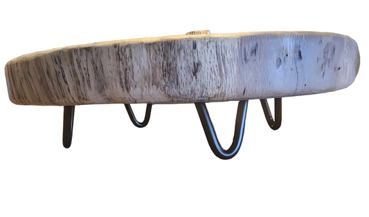 Wooden coaster on a wooden surface with a blurred background