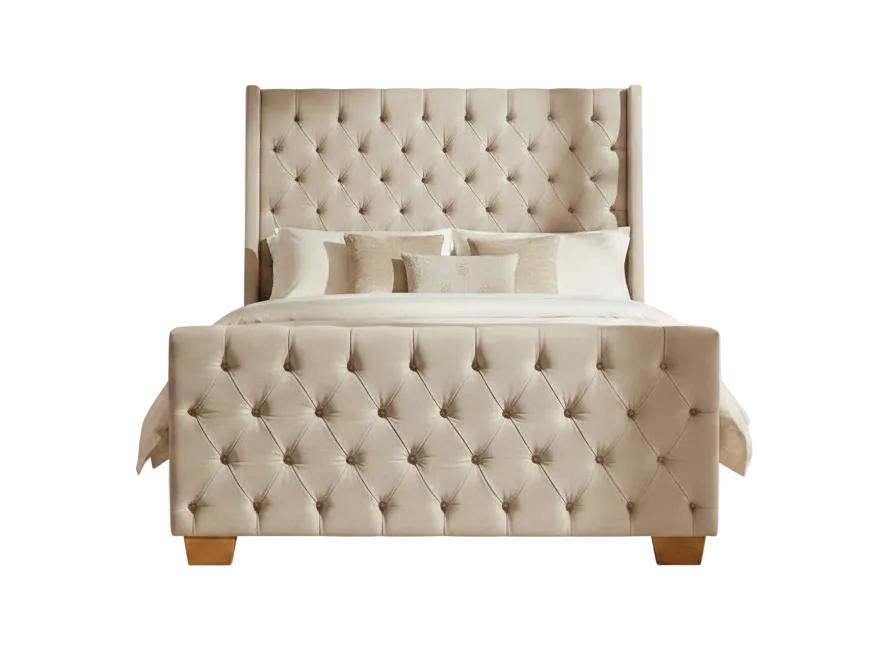 Beige tufted bed with matching pillows on a white background