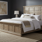 Wooden bed frame with a white mattress on a white background