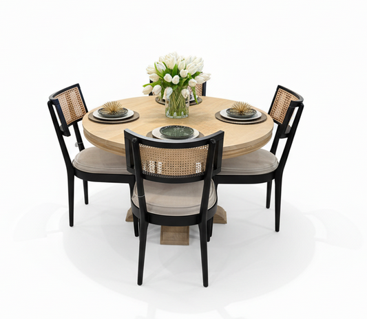 Round solid mango wood dining table with chairs in a room with a white background.