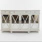 White sideboard with decorative items on a white background