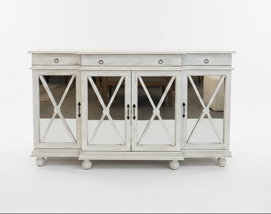 White sideboard with decorative items on a white background