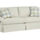 Beige sofa with plaid cushions on a white background