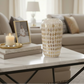 Decorative vase with diamond pattern on a white surface