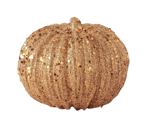 Decorative pumpkin with gold glitter on a white background