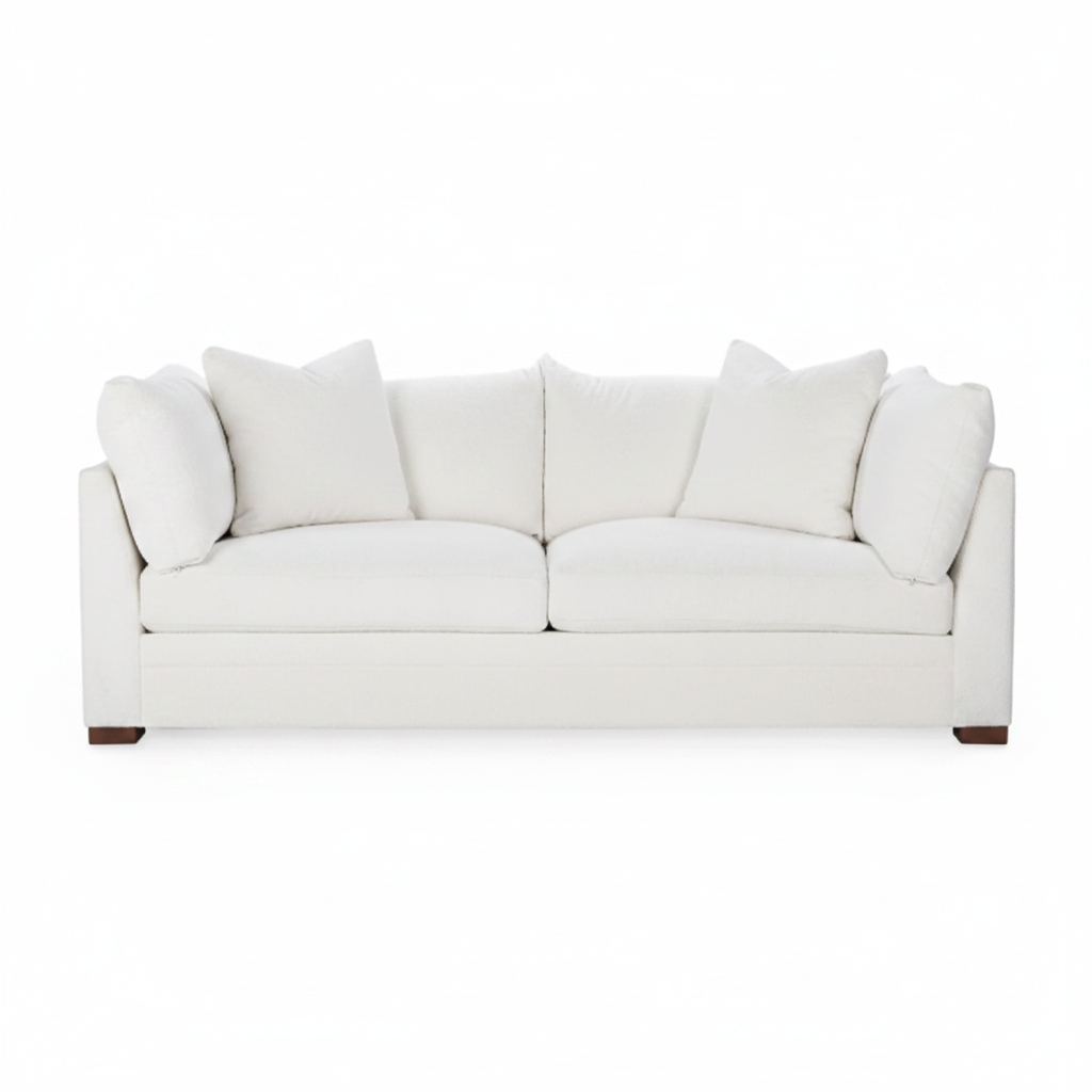White sofa with cushions on a white background