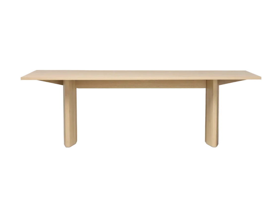 Light wood dining table on a white background