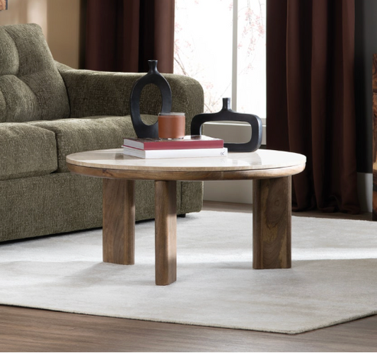 Living room with a green sofa, wooden coffee table, and decorative items.