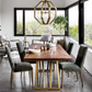 Modern dining room with wooden table and gray chairs near large windows.