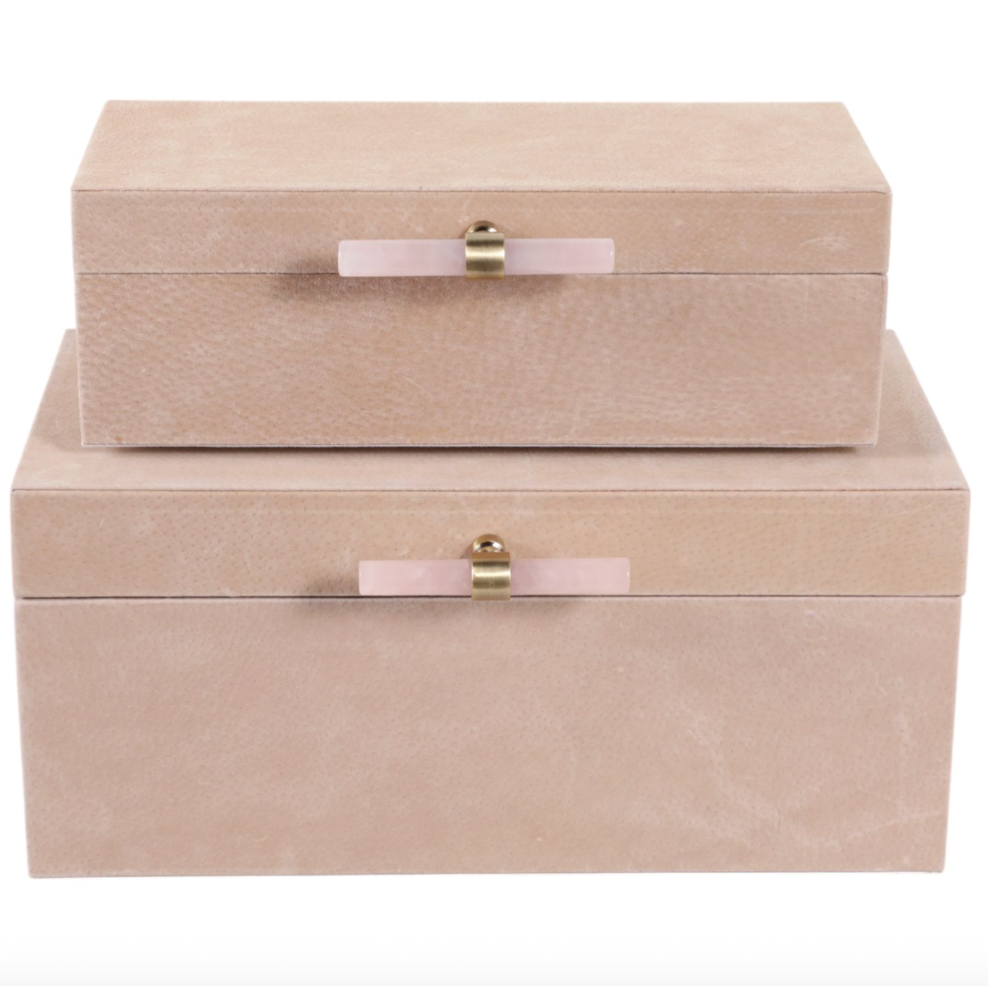 Two beige jewelry boxes with pink ribbons and gold clasps on a white background