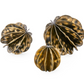 Three metallic decorative items with a star-like design on a white background