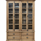 Wooden cabinet with glass doors and drawers in a room setting