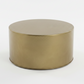 Gold metal round coffee table on a white background