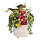 Decorative flower arrangement in a white textured vase on a wooden surface with a gray background