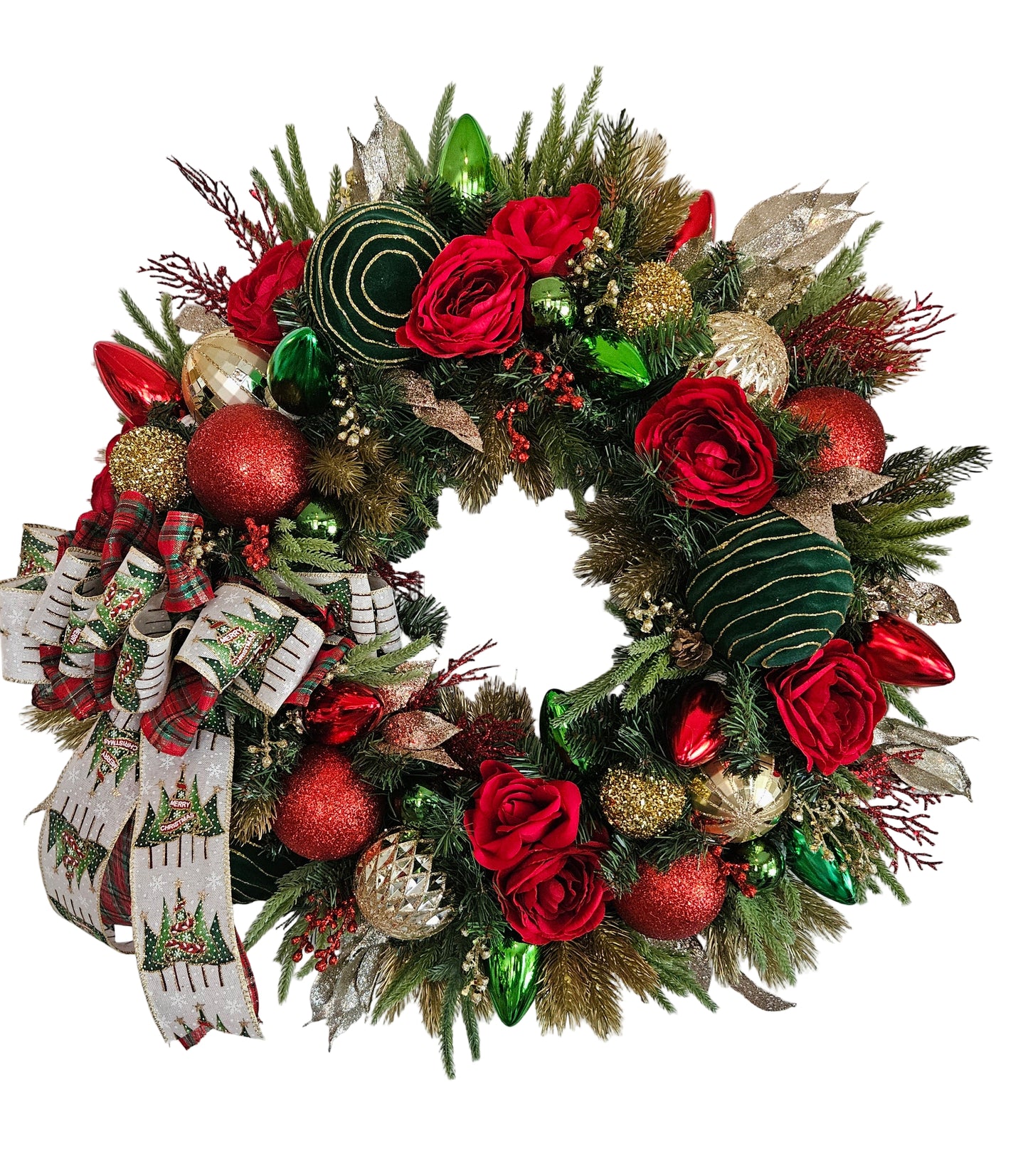 Decorative Christmas wreath with red flowers, gold and green ornaments on a white door.
