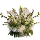 Floral arrangement with white flowers and green leaves on a white background