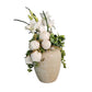 Decorative flower arrangement in a textured vase on a white background.