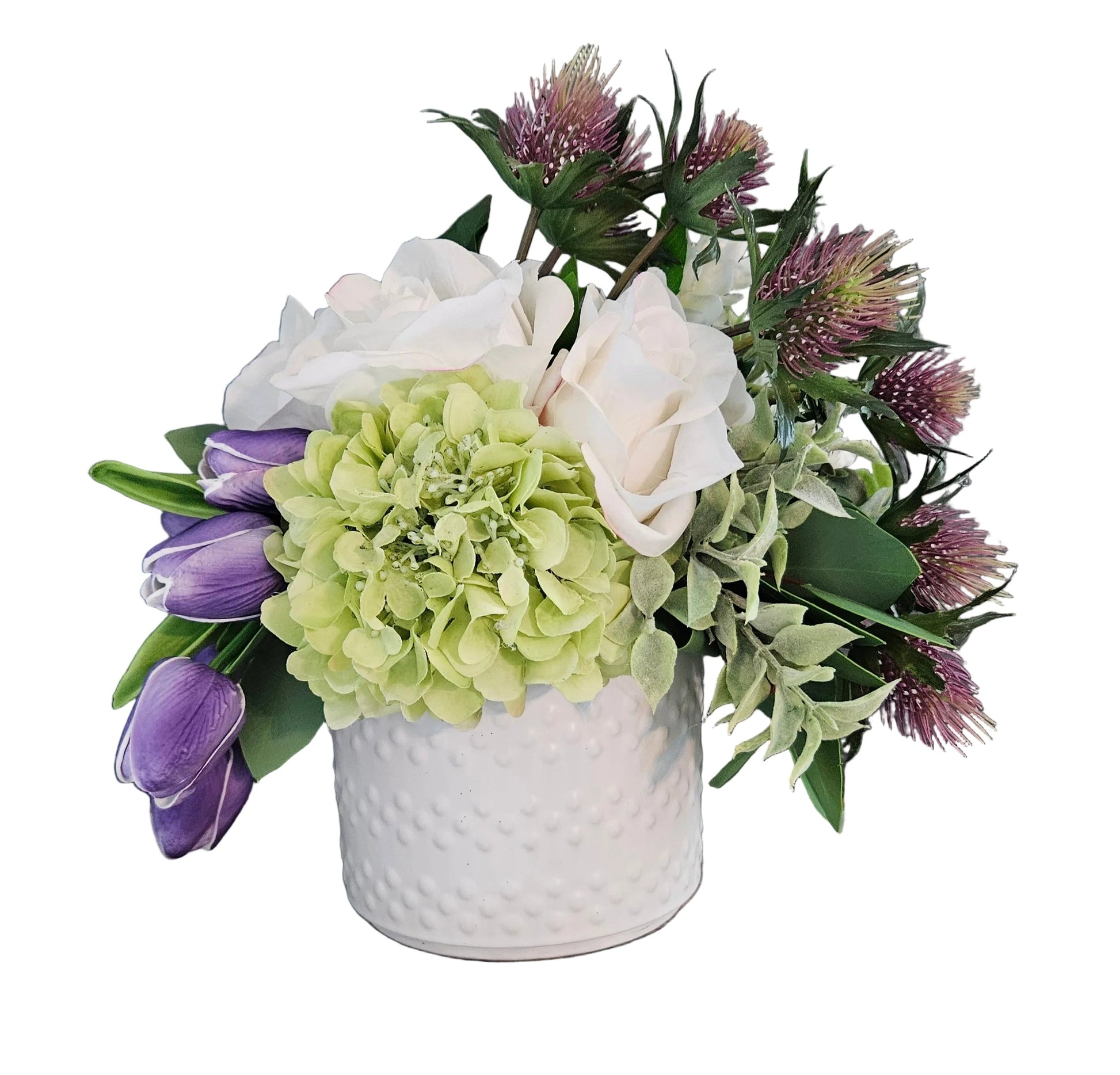 Floral arrangement with green, purple, and white flowers in a white vase on a white background