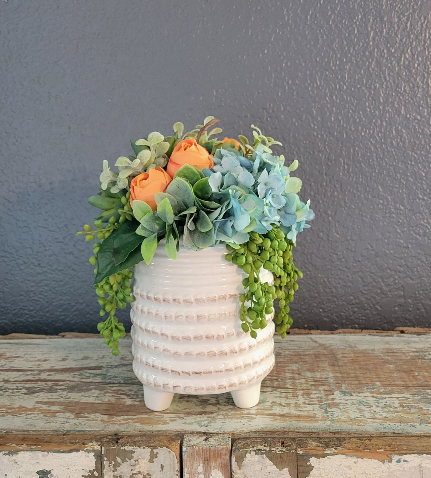 9" Tall Teal And Orange Floral Arrangement